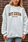 White Sweatshirt Brown Writing